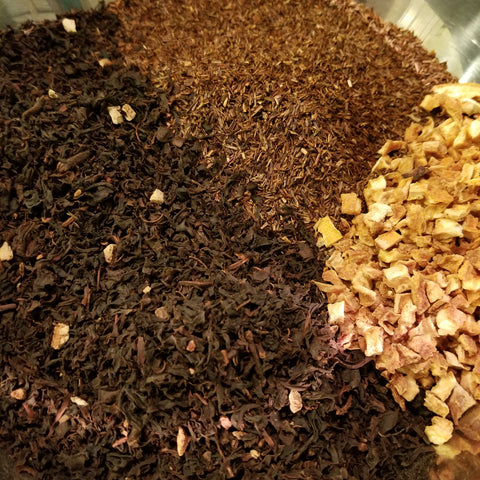 Close-up of a tea bag with different types of tea leaves.